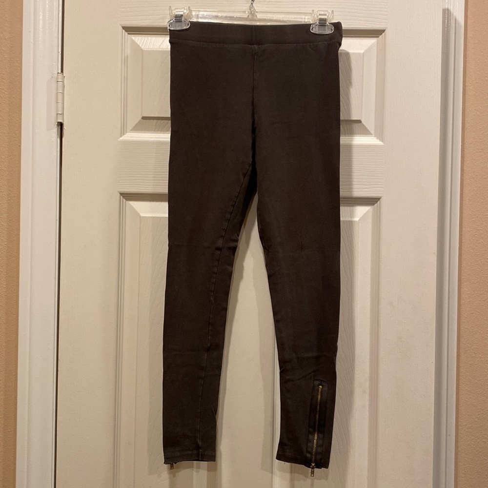 Foreign Exchange leggings with gold zipper accents on each pant leg